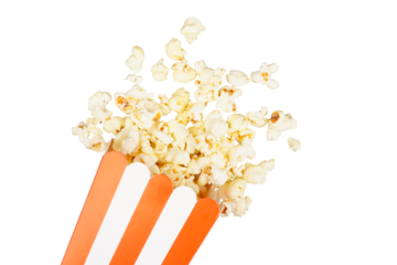 Salted popcorn spilling out of red and white cardboard box used as a border frame