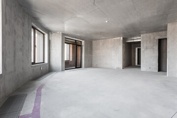 interior of the apartment without decoration in gray colors. rough finish