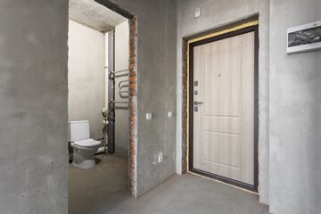 interior of the apartment without decoration in gray colors. rough finish