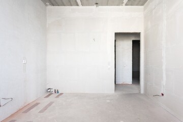 interior of the apartment without decoration in gray colors. rough finish