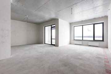 interior of the apartment without decoration in gray colors. rough finish