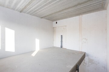 interior of the apartment without decoration in gray colors. rough finish
