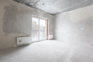interior of the apartment without decoration in gray colors. rough finish