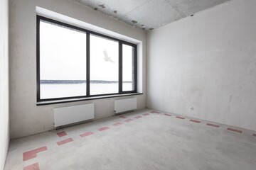 interior of the apartment without decoration in gray colors. rough finish