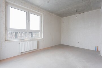 interior of the apartment without decoration in gray colors. rough finish