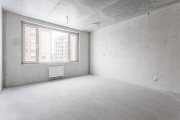 interior of the apartment without decoration in gray colors. rough finish