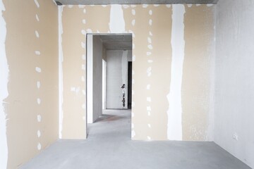 interior of the apartment without decoration in gray colors. rough finish
