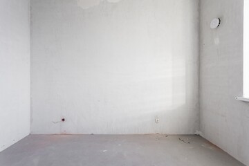 interior of the apartment without decoration in gray colors. rough finish
