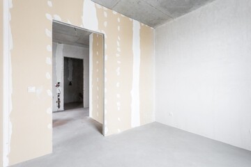 interior of the apartment without decoration in gray colors. rough finish