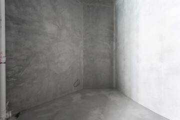 interior of the apartment without decoration in gray colors. rough finish