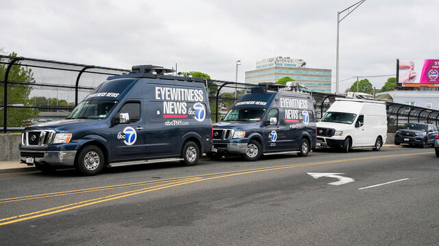 News van parking for covering I-95 demolishing bridge from tractor-trailer fire on I 95 on May 2