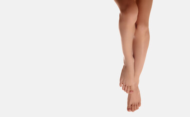 Hair Removal Concept. Beauty Body Care Concept. Beautiful well-groomed women's legs close-up on a white isolated background, The concept of epilation of foot skin care or getting rid of cellulite - Powered by Adobe
