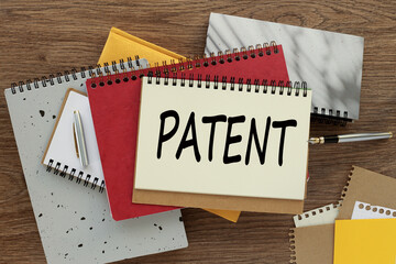 Patents Business concept. Top view, empty notepad and stationery on the table.