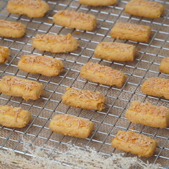 Fresh from the oven crunchy kaastengels cookies Indonesian cookies typically served during Hari Raya Idul Fitri
