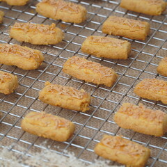 Fresh from the oven crunchy kaastengels cookies Indonesian cookies typically served during Hari Raya Idul Fitri
