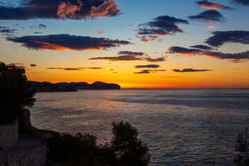 Sunrise over Punta Moraira (Cabo de Oro) Costa Blanca, Image shows the large rocks and cliffs from...