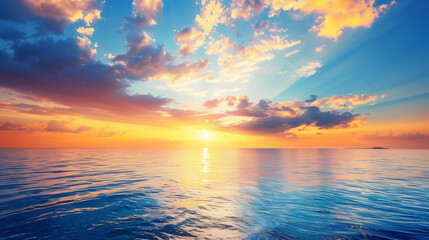 Fototapeta premium The sun is shining on the ocean, creating a beautiful and serene scene. The water is calm and the sky is clear, making for a perfect day to relax and enjoy the view