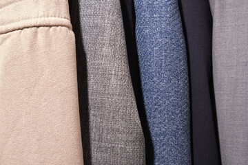 coats and jackets in different colors in the closet