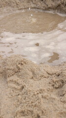 Beach sand and the sound of waves