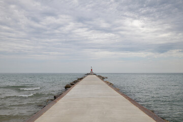 Light house warning tower on the breakwater wall