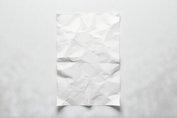 Crumpled Creativity White Paper on Grey Backdrop.