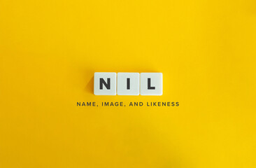 Name, Image, and Likeness (NIL) Banner. Text on Block Letter Tiles on Flat Background. Minimalist...