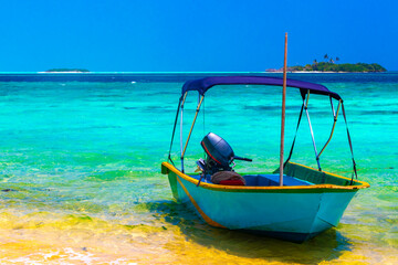 Motor engine of speedboat in the blue turquoise water Maldives.