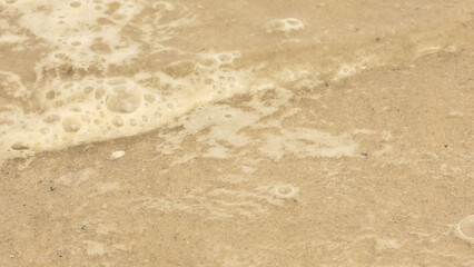 Beach sand and the sound of waves