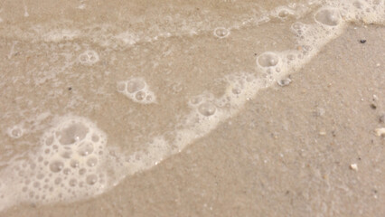 Beach sand and the sound of waves