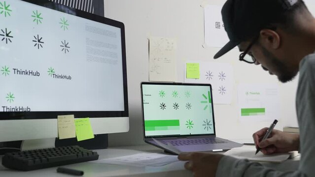 Young Asian Graphic designer working in office. Designing logo Artist Creative Designer Illustrator Graphic Skill Concept.