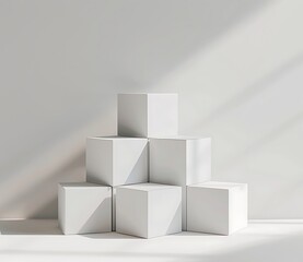 A set of white boxes are stacked on top of each other in the center of an empty space with a white background