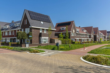 Private solar panels on a family house integrated on the roof. View of solar panels (solar cell) in...