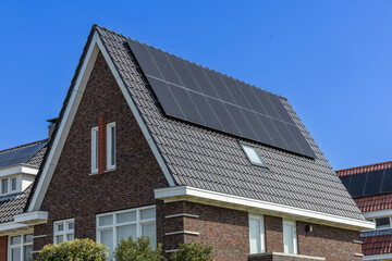 Detail of solar panels on a family house integrated on the roof. View of solar panels (solar cell)...
