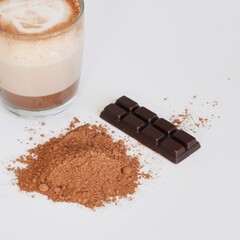 Handmade chocolate with glass of hot chocolate