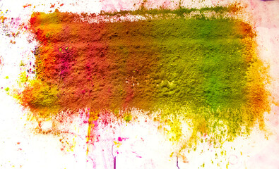 Colored powder. shades of orange, red, and green predominate, on a white background
