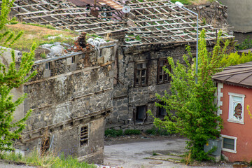 Tarihi Erzurum Tas Evleri or Traditional Erzurum stone houses on cobblestone street.