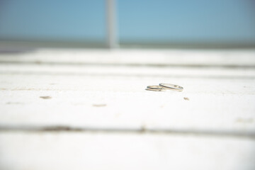 Happy day. Wedding, two wedding rings lie on the pavement.