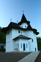 A white church with a cross on top