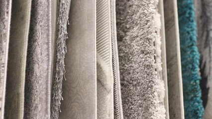 Many Carpets in Construction Hypermarket or Home Improvement Store. Variety of Rugs on Display at Building Materials Shop. Close Up Footage