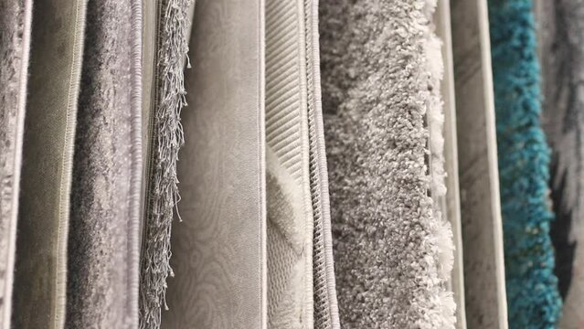 Many Carpets in Construction Hypermarket or Home Improvement Store. Variety of Rugs on Display at Building Materials Shop. Close Up Footage
