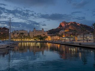 Night view of the port and castle Santa Barbara in Alicante