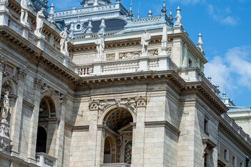 The Hungarian Royal State Opera House located in city center. Beautiful summer day, people on the street in Budapest, Hungary