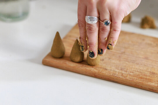 Manual process of making incense cones.