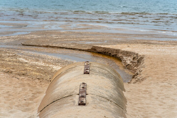 A sewer pipe leading into the sea.