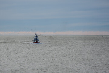 A fishing vessel sailing in the Atlantic Ocean near Mar del Plata, Argentina