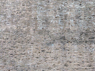 Crumbling old brick and stone wall