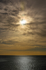 Sunrise over the ocean on a cloudy day