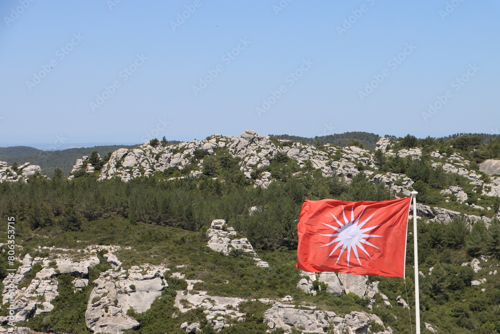 Wall mural rocky nature in provence with flag