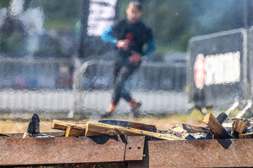 Obstacle from a burning bonfire. The bonfire is on the way for athletes. Air convection. Mixing of...