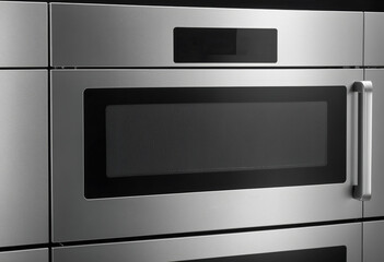 Obraz premium Modern stainless steel microwave oven. Kitchen appliance